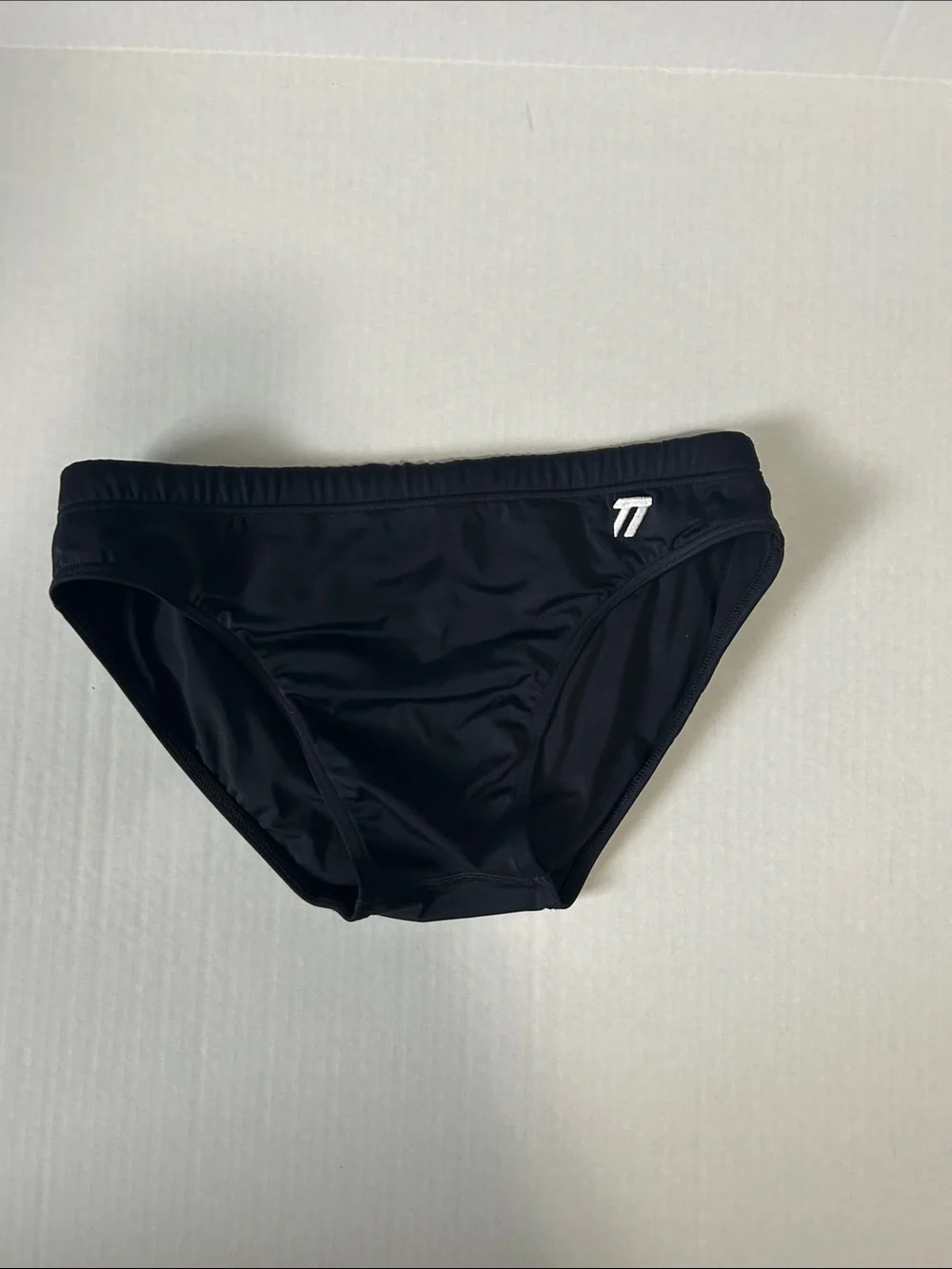 Petra Fashions Black Swim Trunks with White Logo Accent